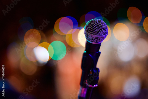 Focus on microphone before heavy metal concert in vibrant atmosphere photo