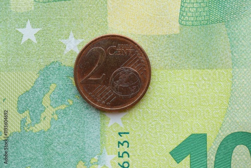 European currency euro cent coin lies on euro banknote bill photo