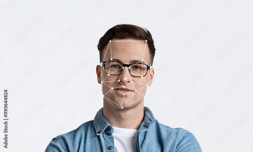 A man stands confidently with crossed arms, showcasing facial recognition technology overlaying his features. The background is minimalistic, creating a focus on the subject. A man stands confidently with crossed arms, showcasing facial recognition technology overlaying his features. The background is minimalistic, creating a focus on the subject.