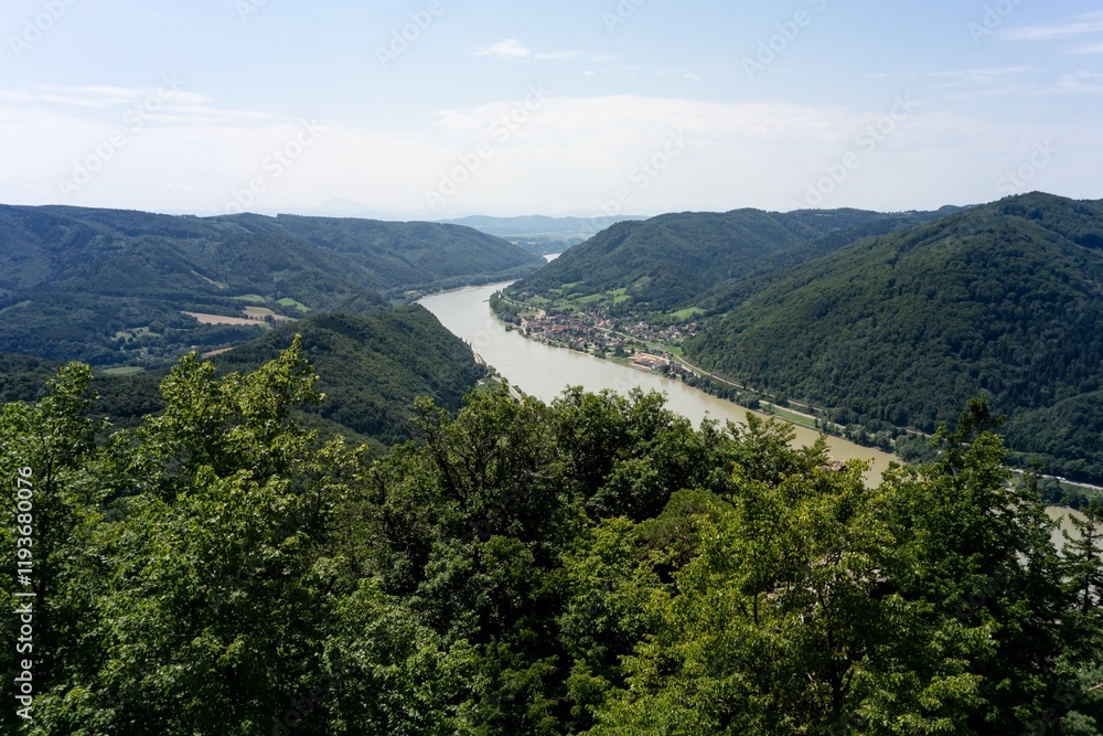 Landscape of Aggstein village in Austria with muddy Danube river