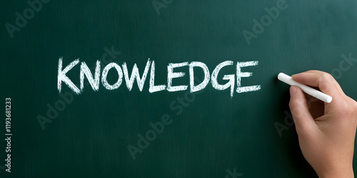 Wallpaper Mural The word 'Knowledge' written in chalk on a chalkboard. A hand is holding chalk, about to add more to the word. Torontodigital.ca