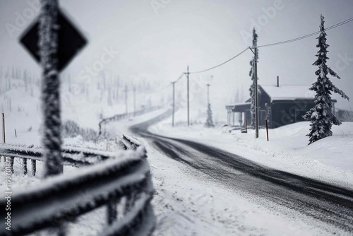Snowy winter road leading to a cabin in a foggy forest landscape
