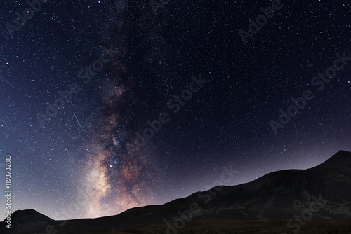 Beautiful night landscape, Bright Milky Way galaxy over the mountains, starry sky.