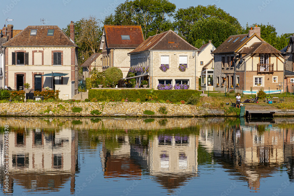 Homes situated along the banks of the Seine River in Normandy, France. Homes situated along the banks of the Seine River in Normandy, France.