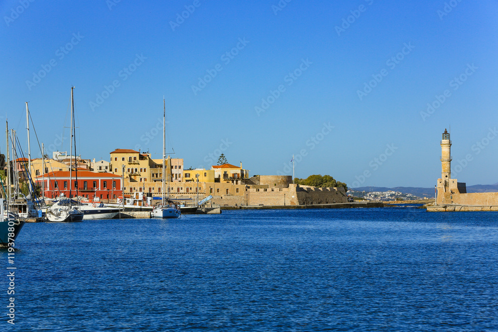 Chania, Crete, Greece. Old town walled city and harbor with lighthouse and boat marina Chania, Crete, Greece. Old town walled city and harbor with lighthouse and boat marina