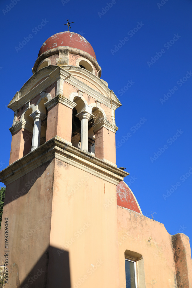 Fototapeta premium Corfu, Greece. Red church dome, terra cotta walls and arched windows