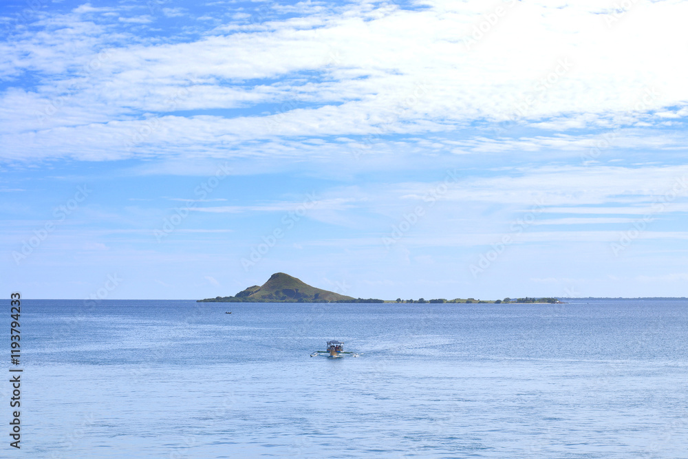 Boat Trip Sails Across Tranquil Ocean Waters with Island Views and Sunny Sky Boat Trip Sails Across Tranquil Ocean Waters with Island Views and Sunny Sky