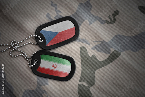 vintage army blank, dog tag with flag of czech republic and iran on the khaki texture background. military concept. photo