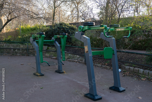 Outdoor fitness equipment in a park for public use during daylight hours photo