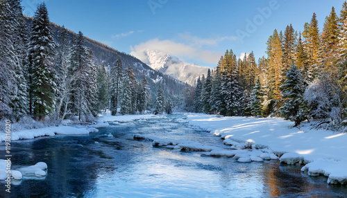 Serene wintry mountain river winding through a snow-covered forest, with icy patches forming along the edges. The river reflects the pale blue sky, surrounded by towering evergreen trees photo