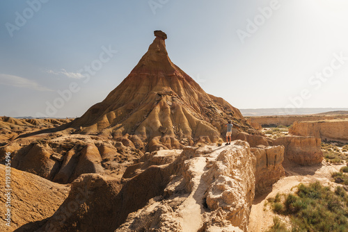 The Castildetierra formation in Bardenas Reales rises prominently against a clear blue sky, surrounded by the raw and arid desert landscape of Spain’s iconic natural wonder. photo