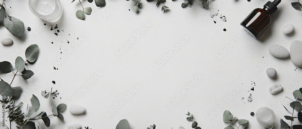 Fototapeta premium Flat lay top view of skincare products background frame. Glass dropper bottle, moisturizer jar, eucalyptus leaves, pebbles. Copy space. Generative AI 