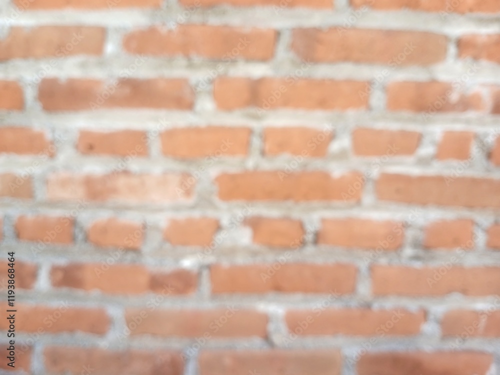 Fototapeta premium Defocused abstract background of red brick wall.