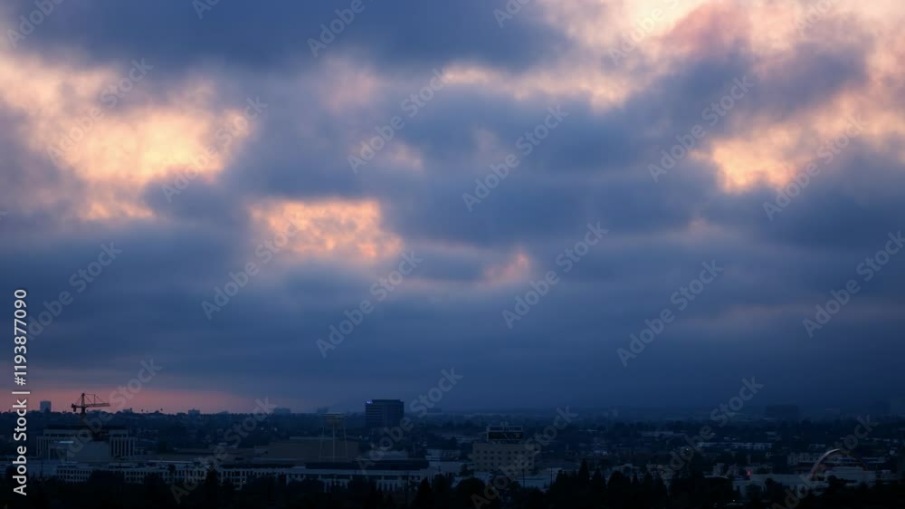 Aerial Lockdown Time Lapse Shot Of Clouds Moving Over Residential Buildings In City From Sunset To Night - Los Angeles, California Aerial Lockdown Time Lapse Shot Of Clouds Moving Over Residential Buildings In City From Sunset To Night - Los Angeles, California