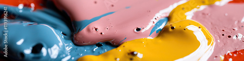 Close-up of Intermixed Blue, Pink, Yellow, and Red Paints photo