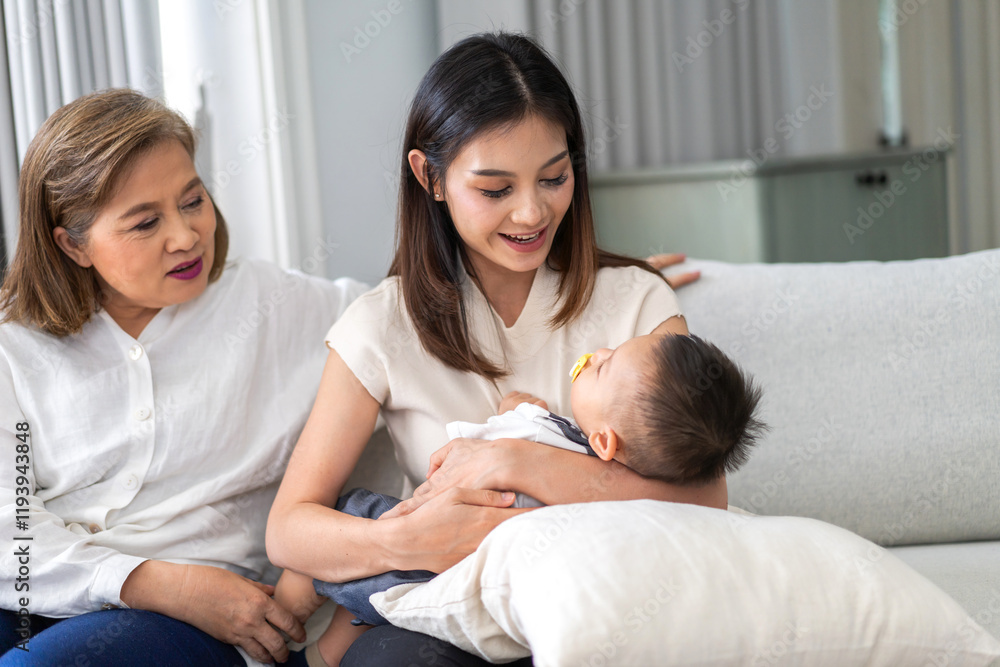 Fototapeta premium Multigenerational asian family at home, grandparents spending quality time with parents and their baby happy moments of love and connection, lifestyle, relationships, parenting, family togetherness