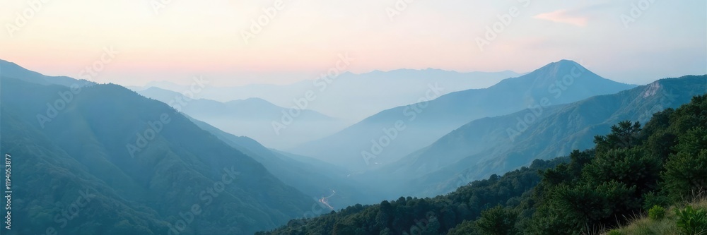 Fototapeta premium A mist-shrouded mountain range stretches into the distance, natural, terrain