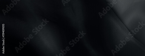 Dark black background with a smooth, flowing texture. The black background adds depth and elegance to the design. Minimal abstract wavy gradient vector background