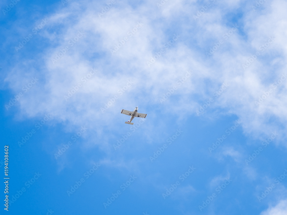 Small ultralight airplane with overhead wing and single propeller flying in sunset sky. Small ultralight airplane with overhead wing and single propeller flying in sunset sky.