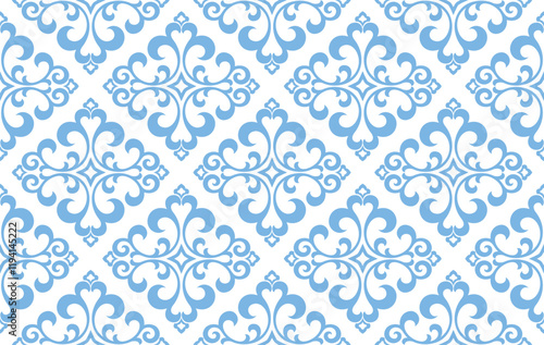 Floral pattern. Vintage wallpaper in the Baroque style. Seamless vector background. White and blue ornament for fabric, wallpaper, packaging. Ornate Damask flower ornament