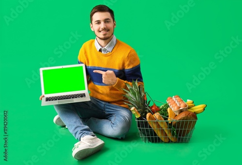 Young man with shopping bas...