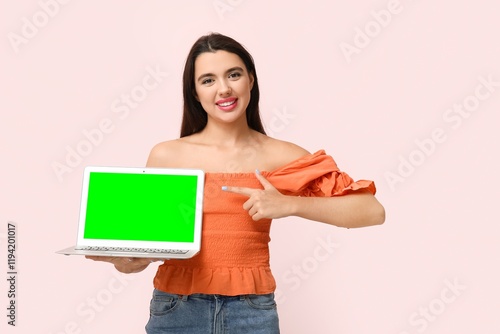Young woman pointing at lap...