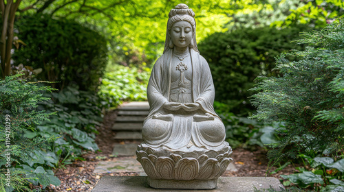 Tranquility in Stone: A serene statue of Kwan Yin, the Buddhist goddess of compassion, sits amidst a lush and peaceful garden, radiating an aura of tranquility and spiritual serenity. photo