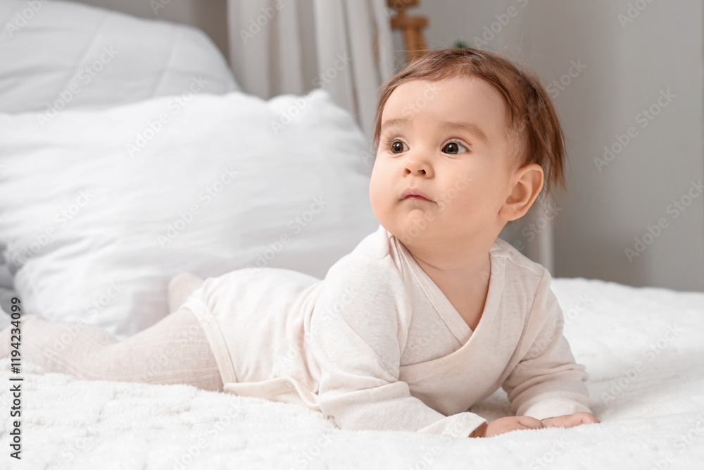 Cute little baby in bed at home, closeup Cute little baby in bed at home, closeup