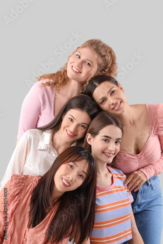 Group of young women on light background