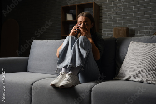 Scared young woman talking ...