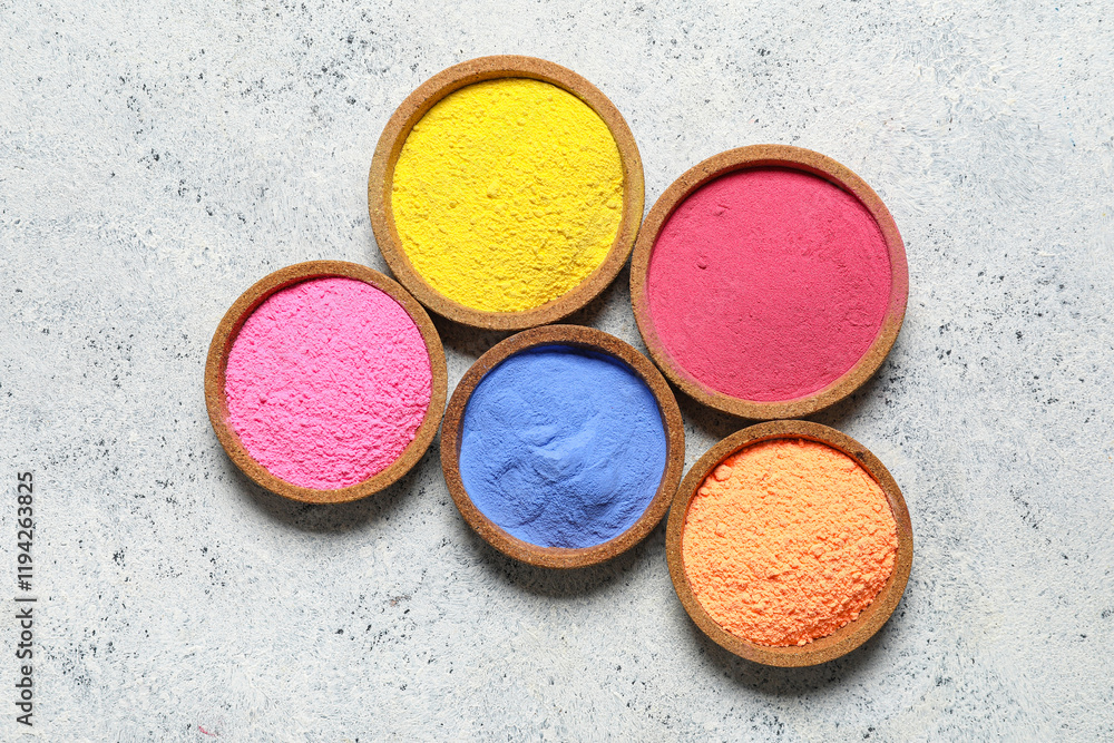 Naklejka premium Bowls of powder pigment on grunge background