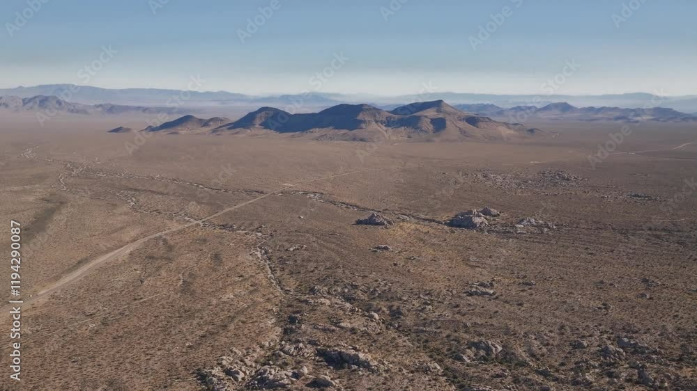 Kelso Pinto Basin Dunes trail road Joshua Tree National Park California aerial drone Yucca Trees San Fernando County Mojave Colorado desert blue sky rugged hill rock formation sunny afternoon forward Kelso Pinto Basin Dunes trail road Joshua Tree National Park California aerial drone Yucca Trees San Fernando County Mojave Colorado desert blue sky rugged hill rock formation sunny afternoon forward