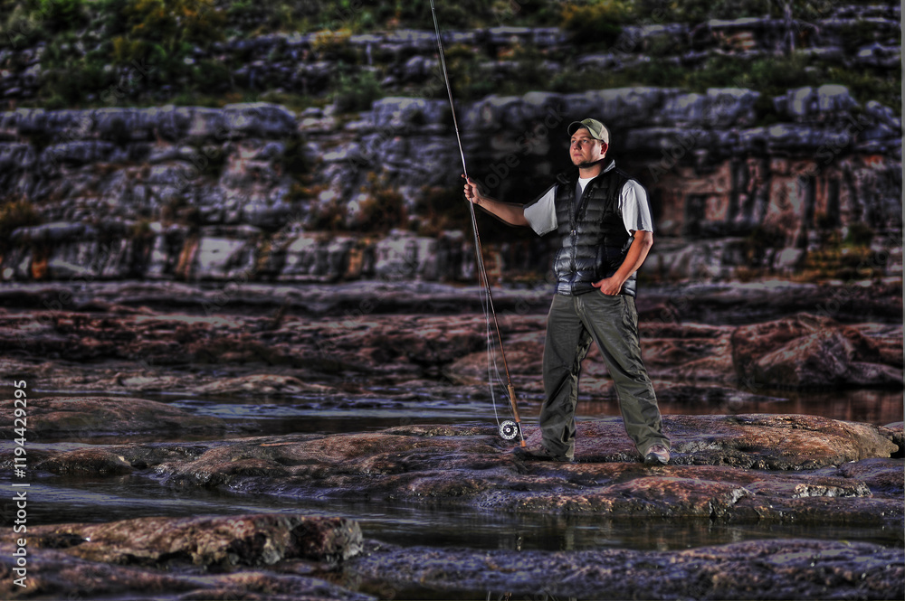 Flyfisherman Colorado riverside with rod in Marble Falls, Texas. Flyfisherman Colorado riverside with rod in Marble Falls, Texas.