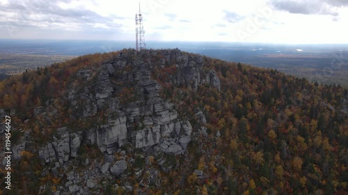 Flight around the big forest rock Polyd photo