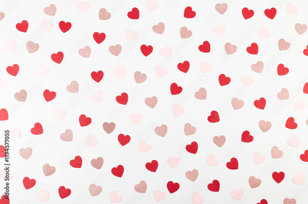 Top view of colorful hearts on white background. Pink glitter hearts, red hearts, pink hearts. Valentine's day, love wallpaper. Flat lay, copy space. Top view of colorful hearts on white background. Pink glitter hearts, red hearts, pink hearts. Valentine's day, love wallpaper. Flat lay, copy space.