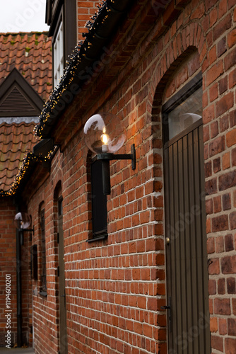 Entrance to the building at Frederiksborg Castle. A lantern in a glass ball on a bracket. photo