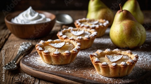 Mini Pear Tarts with Caramelized Tops on a Wooden Board