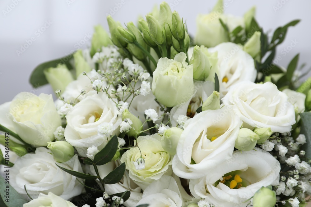 Fototapeta premium Beautiful wedding bouquet on light background, closeup.