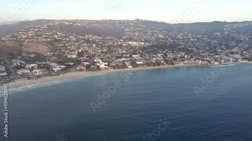 Downtown Laguna Main Beach, at Sunset. Orange County Shore Line, Southern California Coast, USA. Drone View Pacific Ocean. Shops, Businesses, Beach and Trail. Laguna Canyon - PCH Pacific Coast Highway photo