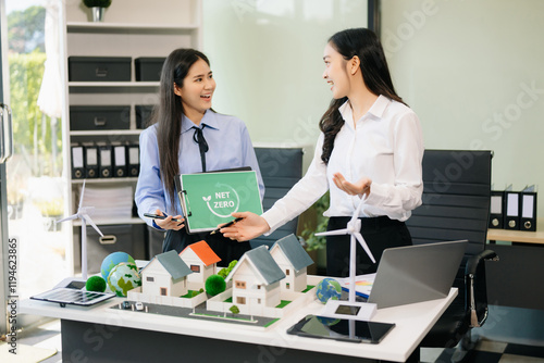 Business team people planning hand using laptop for working technology and business Net zero photo