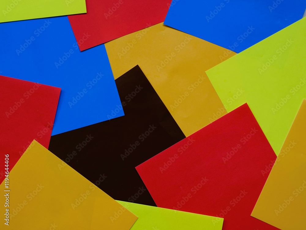 Textured colorful paper scraps create vibrant artistic backgrounds. Randomly scattered colorful papers for abstract artistic backdrop.
