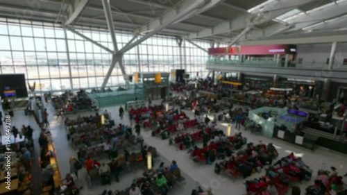 Busy interior of Heathrow Airport with many travelers in 4k