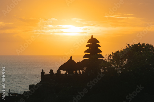 Golden sunset over Tanah Lot Temple and sea in Bali, Indonesia