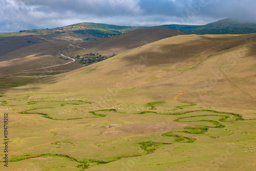 Persembe Plateau with meanders and grazing a flock of sheep photo