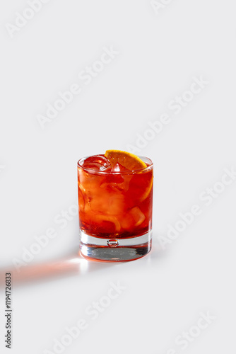Fresh Americano cocktail with orange and ice, stock, on white background