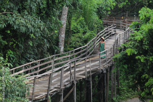 mulher em palafitas de hotel de selva em guarajá-mirim, rondonia photo