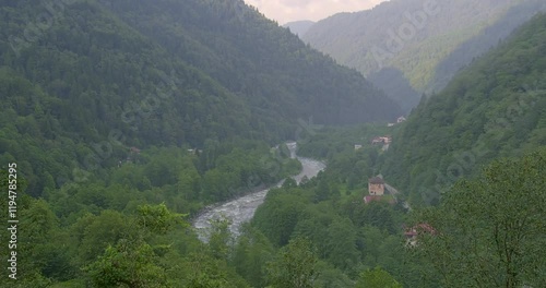 A breathtaking view of the Kackar Mountains in Rize, Turkey, covered in lush green forests and misty valleys. A serene and majestic natural landscape