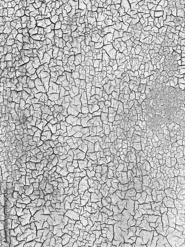 Cracked white paint forming abstract texture background