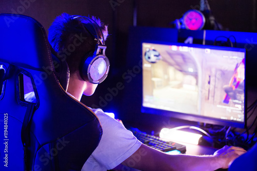 Obraz na plátně Professional gamer is playing a computer game on PC at cyber club