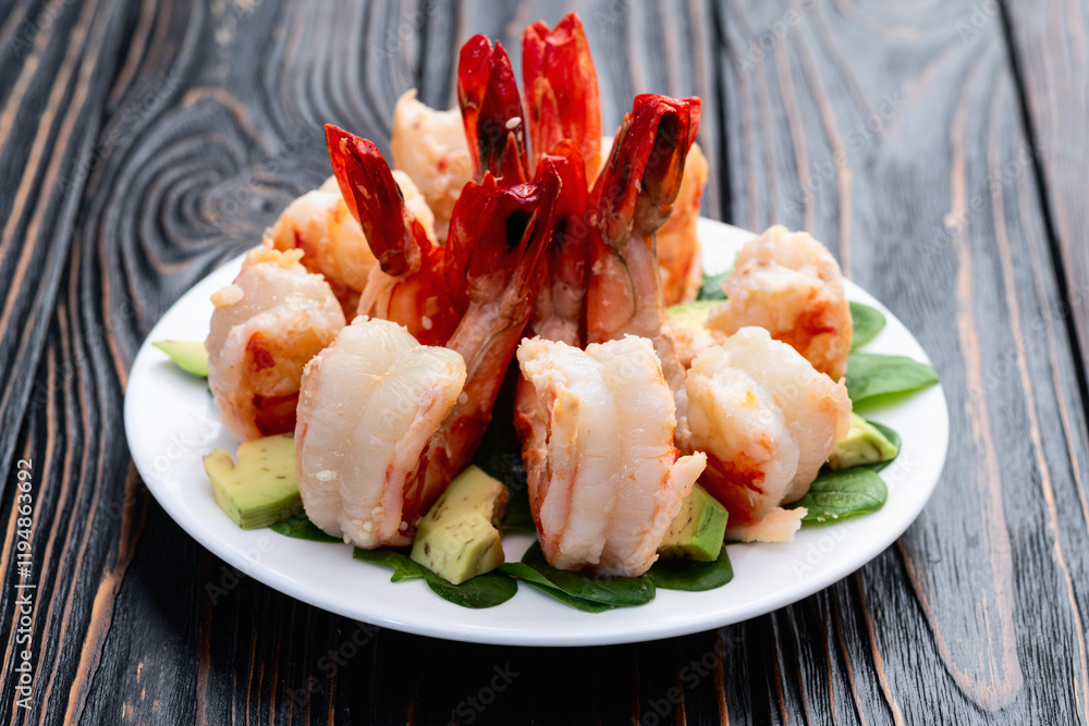 Salad with tiger shrimps , avocado and mango . Top view Salad with tiger shrimps , avocado and mango . Top view